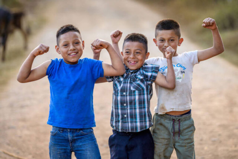 3 Boy Kids Showing their Muscles